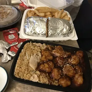 Sesame chicken, chicken fried rice combo, crab cake sandwich and fries