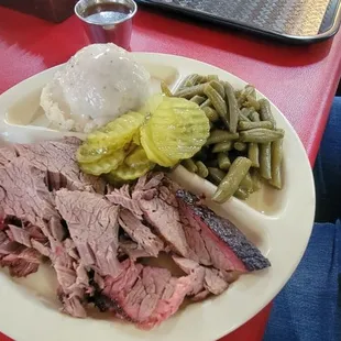 Brisket plate with mashed potatoes and green beans