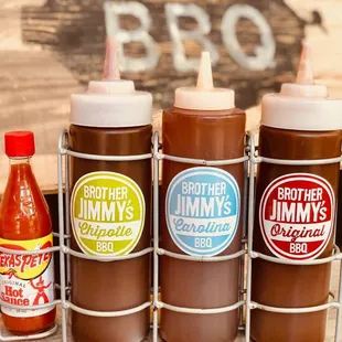 three bottles of barbecue sauce