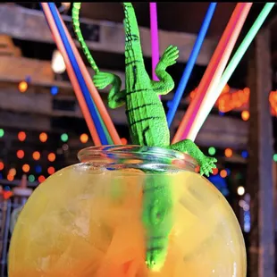 a drink in a glass with straws