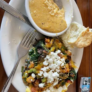 Open face omelet, with garlicky cheese grits and a biscuit straight from heaven.