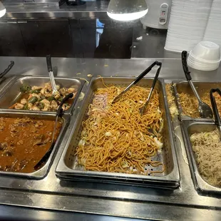a variety of food items in a buffet