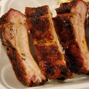 Smoked baby backs. Ribs are sauced unless you ask for no sauce.