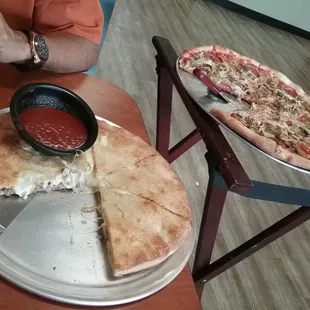 a pizza with a slice taken out of it