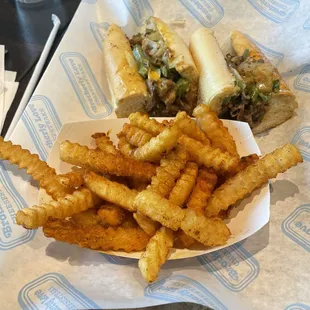 Lil Bro Cheesesteak with onions, whiz cheese,bell pepper and mushrooms.   With season fries (old bay and garlic powder seasoning)