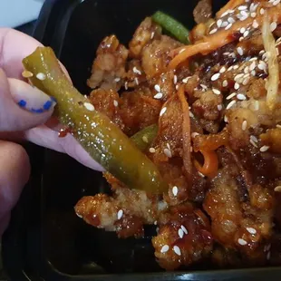 made with carrots and bell pepper strips, which I thought were string beans in the pics. Basically orange beef made w chicken,