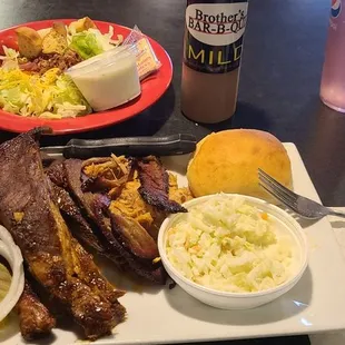 Combo plate with  half chicken, 3 spare ribs, about 1/4 pint of pulled pork, 3 slices of  brisket, roll, and 2 sides