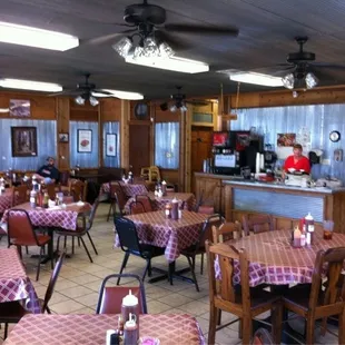 a restaurant with tables and chairs