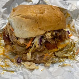 a pulled pork sandwich with cole slaw