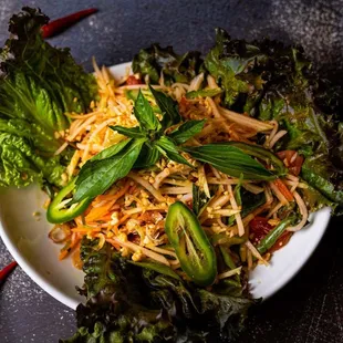 14. Papaya salad
Spicy green papaya salad with fresh lime juice, tomato, green bean, peanut and dried shrimp