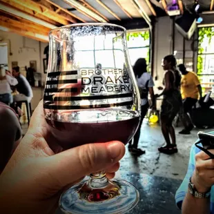 a person holding a glass of wine