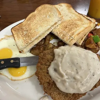 Country Fried Steak covered in country gravy and 2 Eggs Combinations