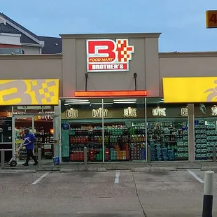 people walking in front of the store