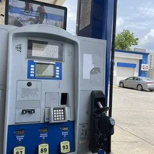 a gas pump and a car