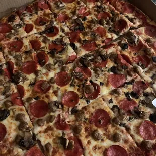 20&quot; with pepperoni, Italian sausage, and mushrooms