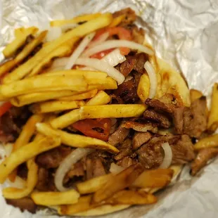 The authentic Greece street gyro is actually pork and fried potatoes