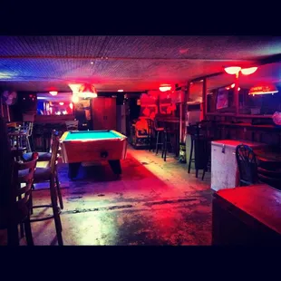 The pool table, a broken Ms. Pacman game and the cig machine