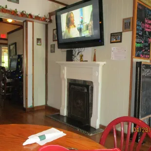 Brother&apos;s Italian Restaurant (Providence Forge): Interior: Far left, arcade games; Center, Gospel TV + faux fireplace.