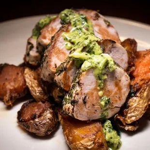 a plate of food with meat and vegetables