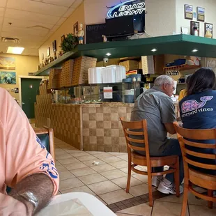 a man sitting at a table in a restaurant