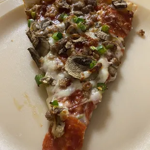 Slice of House Delux pizza, yum!