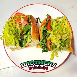 two sub sandwiches on a plate