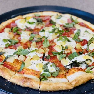 a pizza on a black plate