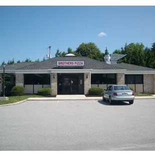a car parked in front of a restaurant