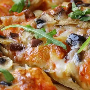 a closeup of a sliced pizza