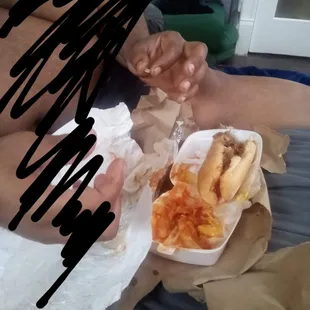 a man eating a hot dog