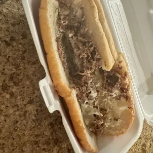 a sandwich in a styrofoam container