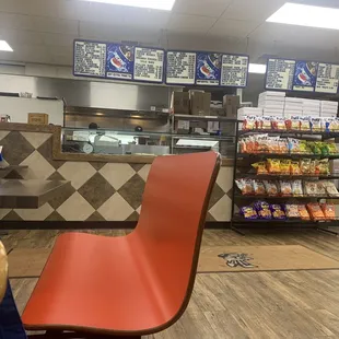 a red chair in front of the counter