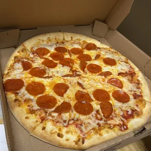 a pepperoni pizza in a box