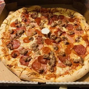 pepperoni and sausage pizza in a box