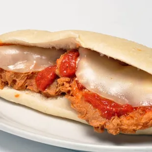 Hand breaded  chicken breast smoothed in our  scratch made spaggetti sauce and Famous Italian bread