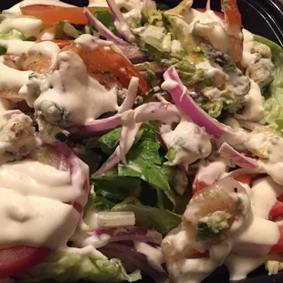 Black and Blue salad with grilled shrimp,onions,chunks if blue cheese, tomatoes and avocado.