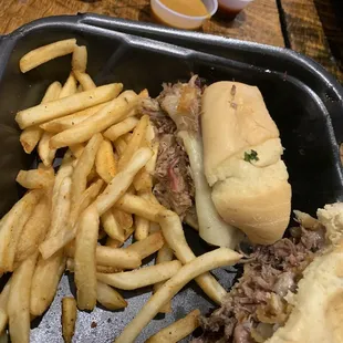 Half a bronco and half pig in the orchard with fries