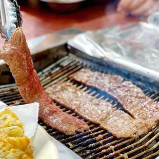 Grilled marinated beef short rib (kalbi) is a must get at Korean bbq. SO DELICIOUS AND TENDER!!