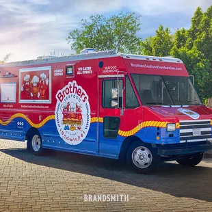 a red and blue food truck