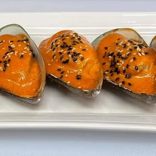 a platter of sushi burritos