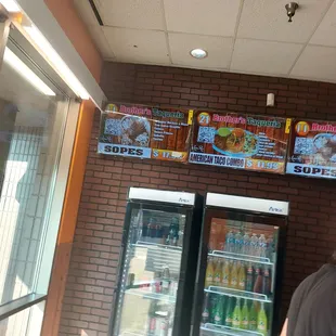 a man standing in front of a refrigerator