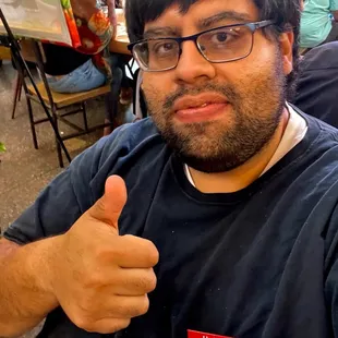 Me with my Cabrón name tag pin on