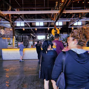 a group of people standing in a building