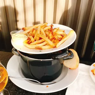 a plate of fries and a glass of beer