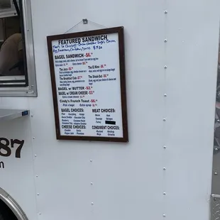 a menu on the side of a food truck