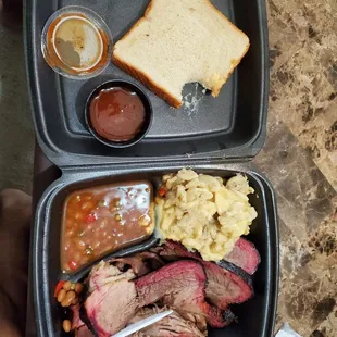 The 2 meat plate.  Brisket and pulled pork. Sides of Mac and cheese and baked beans.  Sauce on the side with a slice of bread