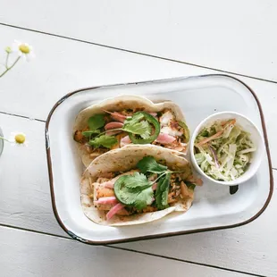 Grilled daily catch tacos with classic slaw