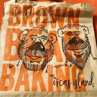 two brown bears on a bag