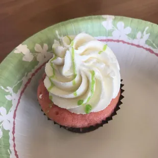 a cupcake on a paper plate