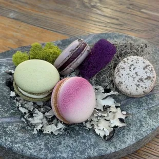 a plate of macarons on a table